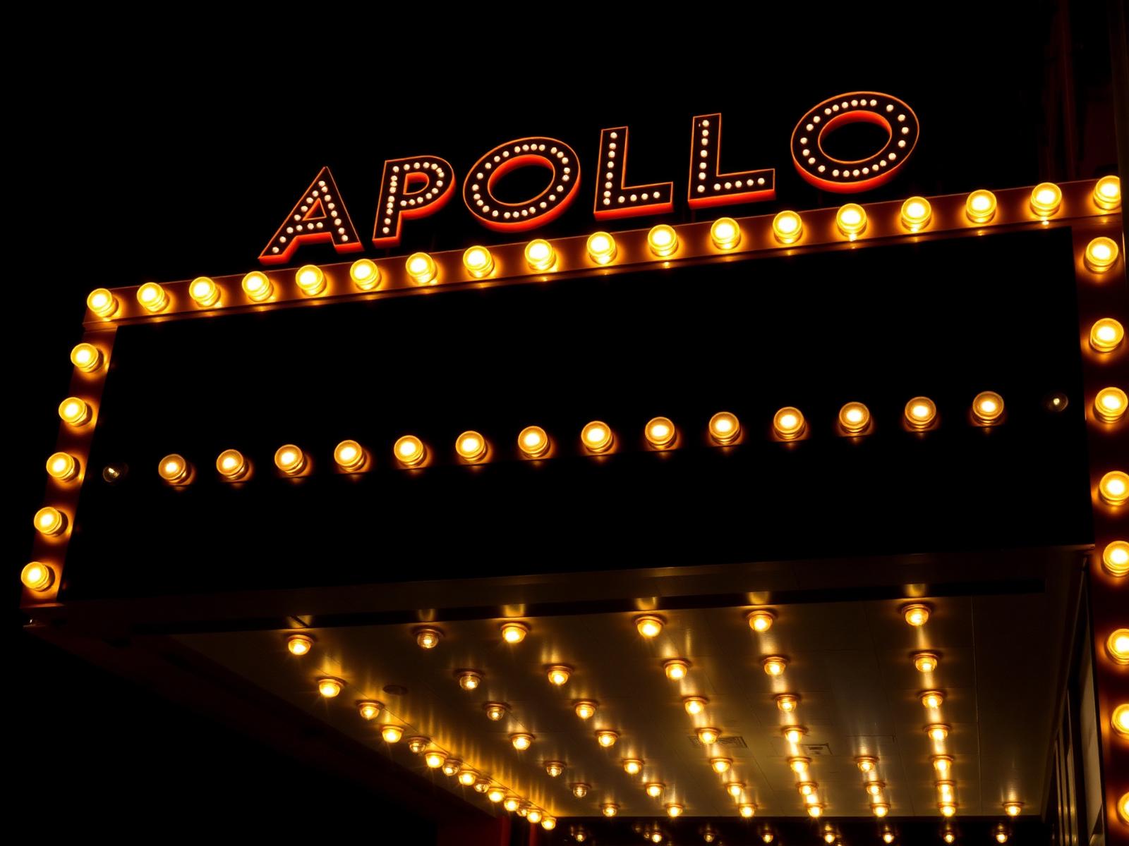 Vintage marquee theater sign with golden bulbs